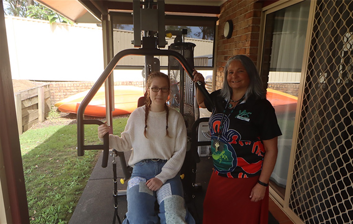 two women posing with new fitness equipment