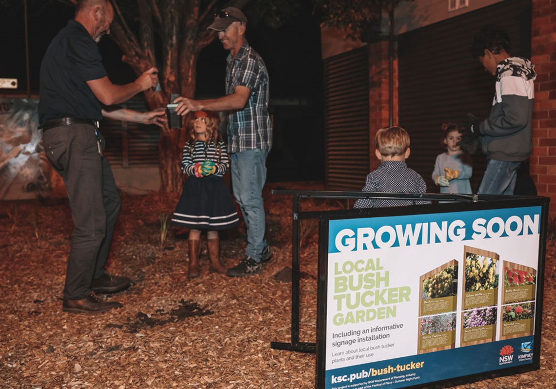 People planting in a garden