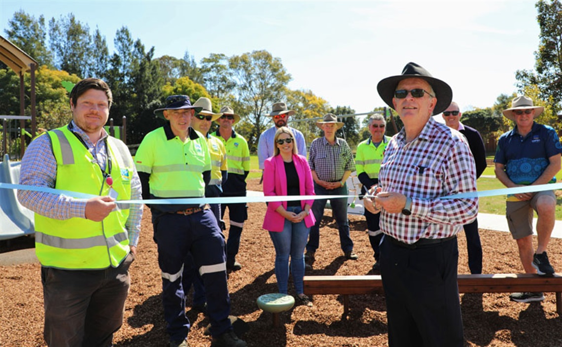 Cutting the ribbon to officially open the upgraded Dock flat playspace.