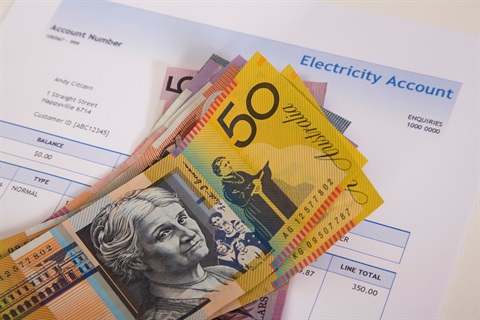 an energy bill and cash